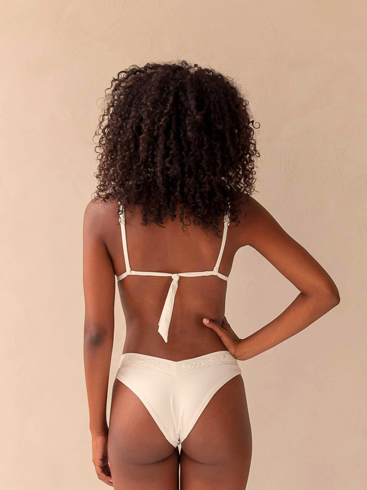 Bikini bottom V-shape and triangle top in ivory white with rib fabric & embroidery, woman backside