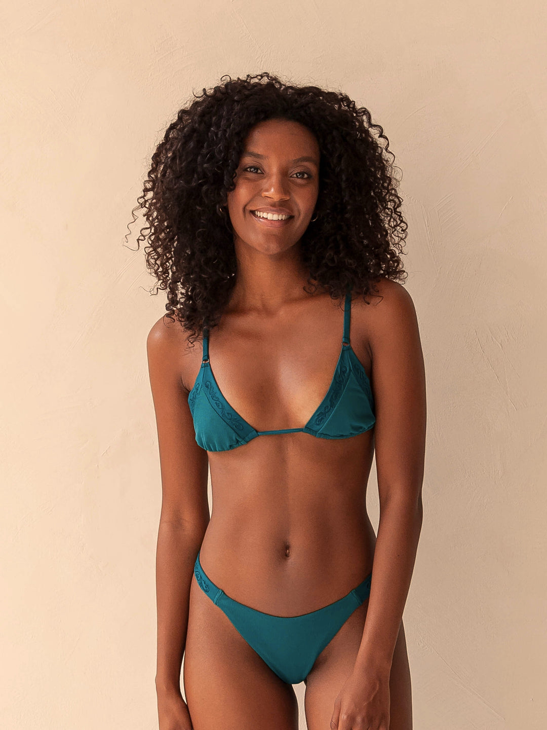 Bikini top triangle and brazilian tanga bottom in green with rib fabric and embroidery, woman front